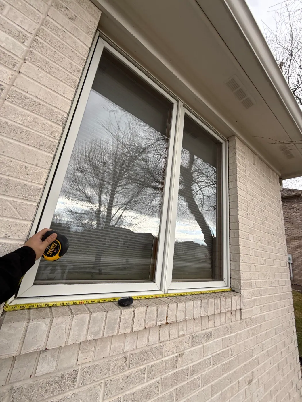 Frame and seal detail on a Brookstone window job
